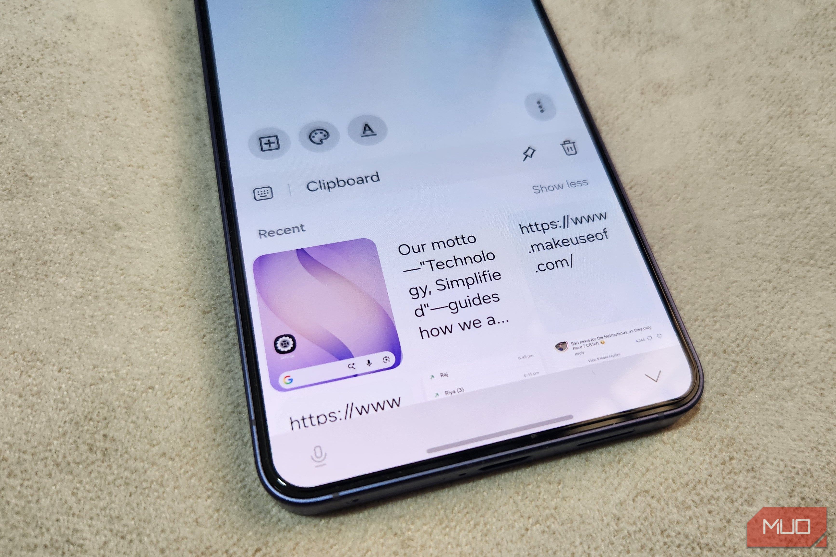 Galaxy phone in hand showing clipboard feature