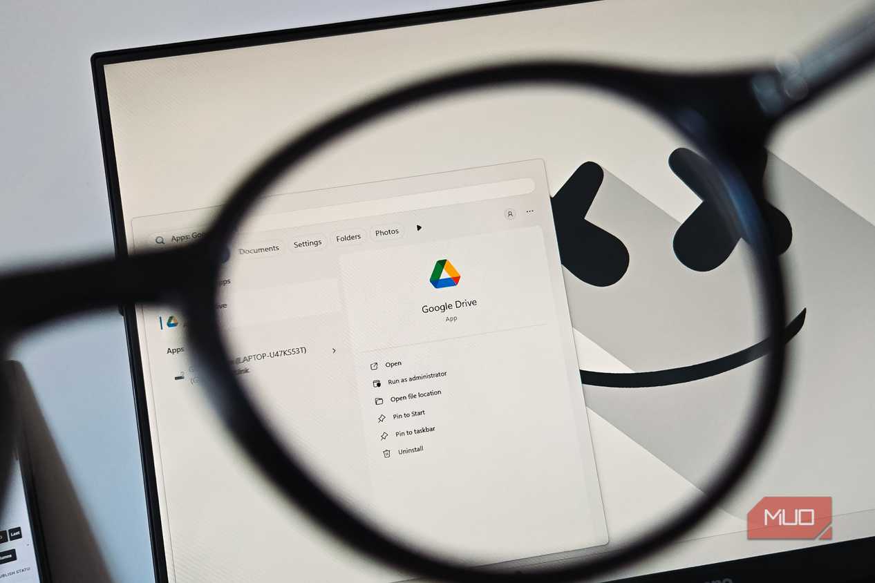 Google Drive app viewed through a magnifying glass on a Windows desktop