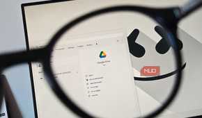Google Drive app viewed through a magnifying glass on a Windows desktop