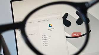 Google Drive app viewed through a magnifying glass on a Windows desktop