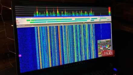 KiwiDSR showing a radio waterfall spectrum on a laptop screen