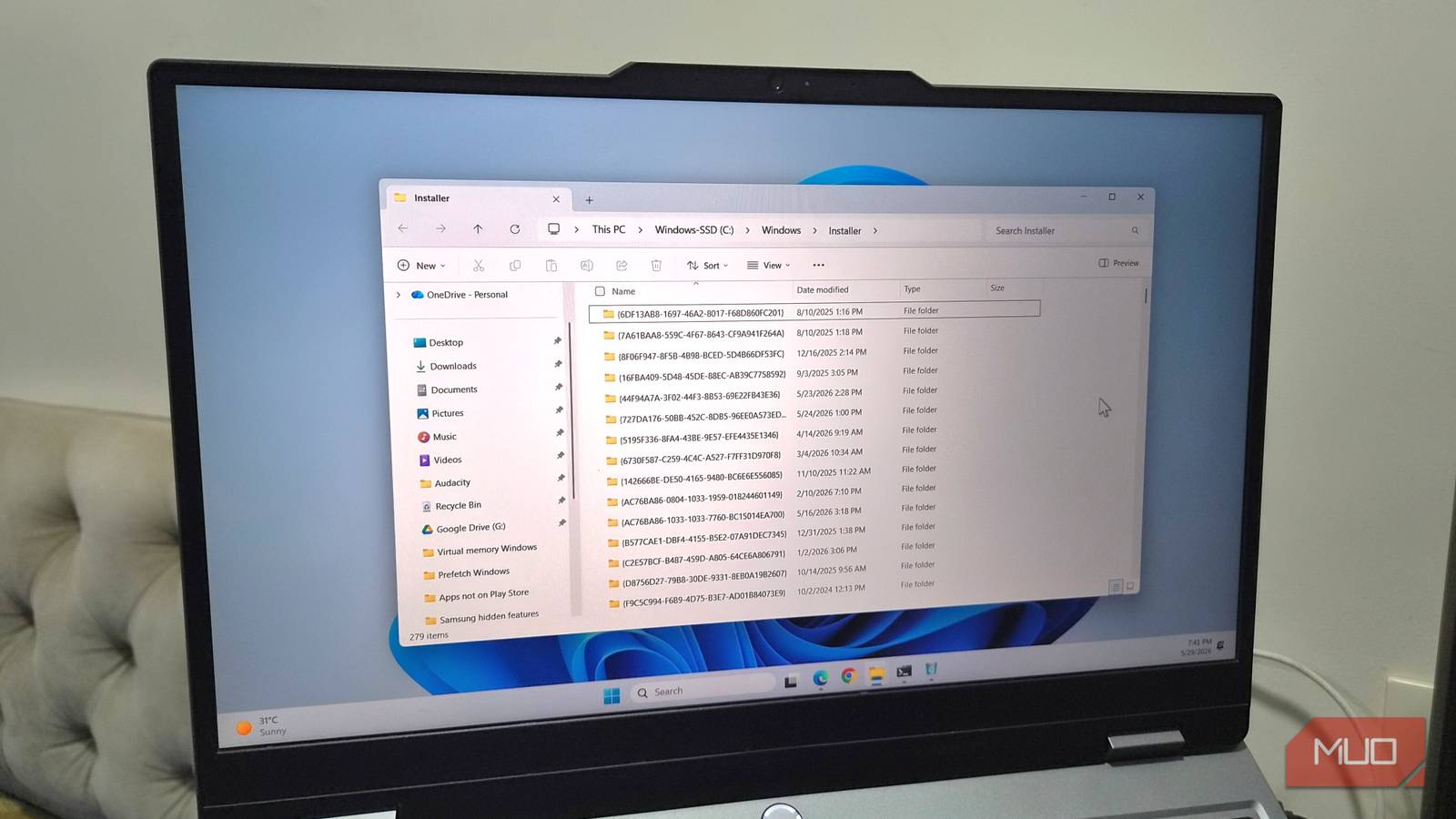 Laptop showing Windows installer folder open on desktop