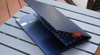 The Lenovo Yoga Slim 7x half-opened.