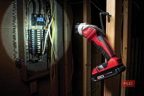 Milwaukee's M18 work light illuminating an electrical panel