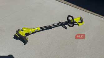 ryobi 18v string trimer on ground