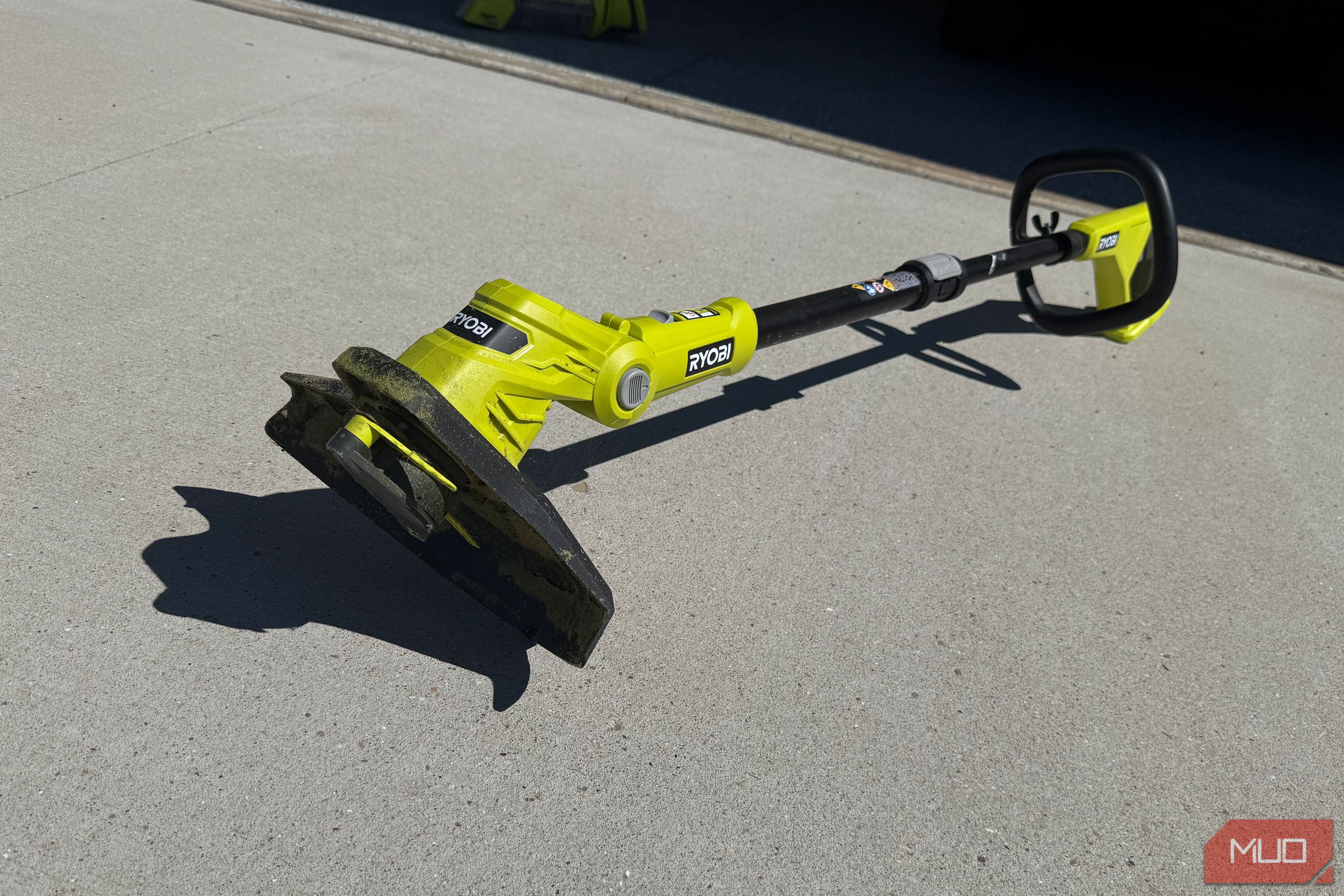 Ryobi 18v string trimmer on driveway outdoors