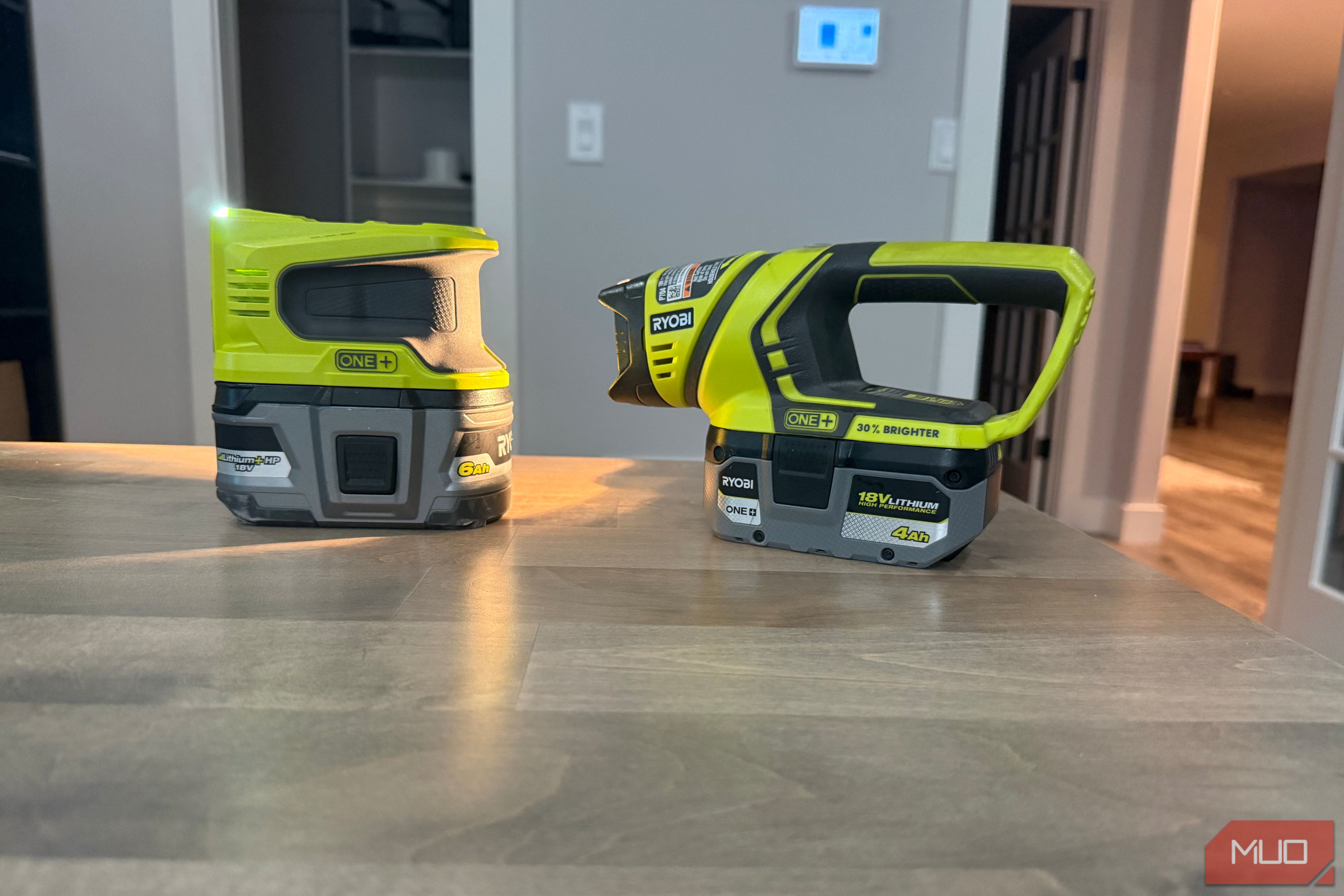 Ryobi power inverter and flashlight on desk angled view