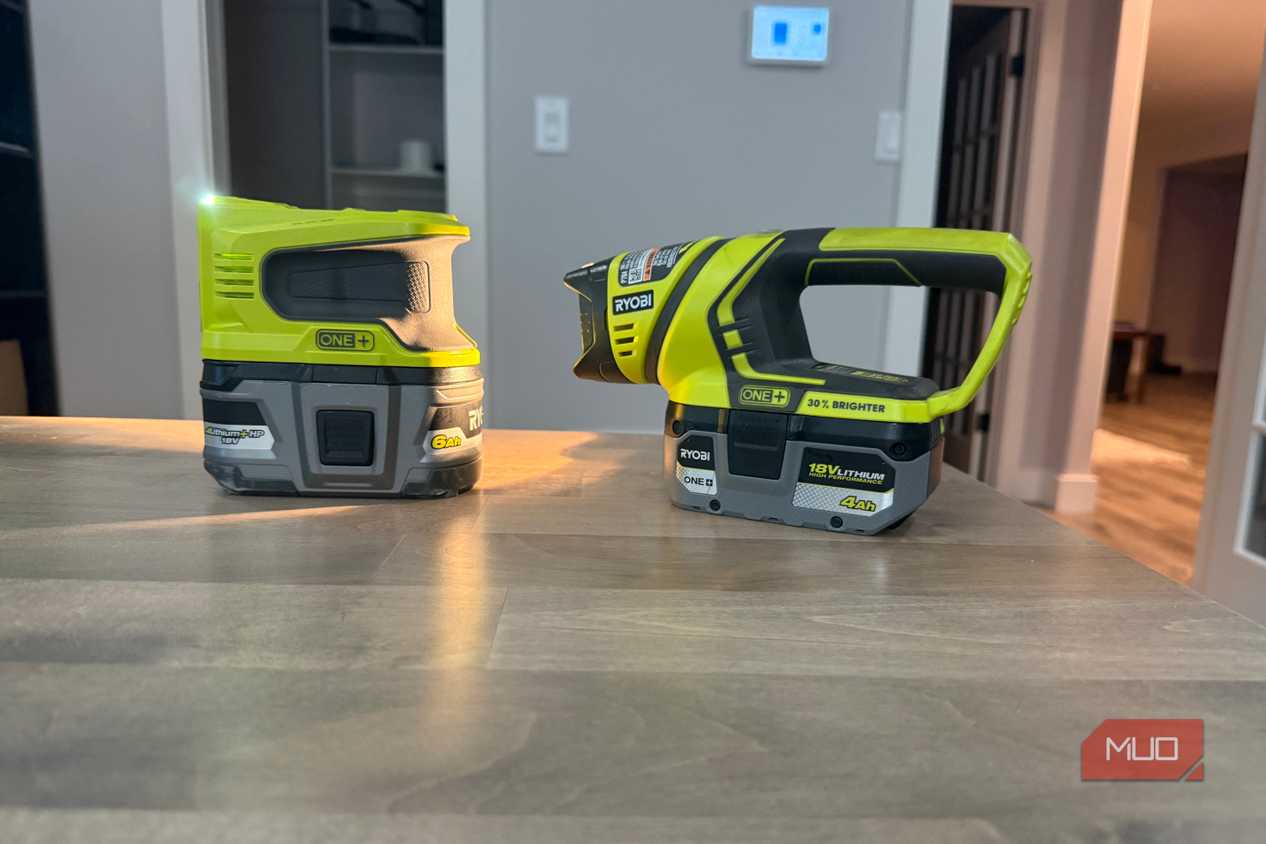 Ryobi power inverter and flashlight on desk angled view