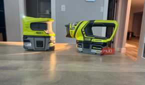 Ryobi power inverter and flashlight on desk angled view