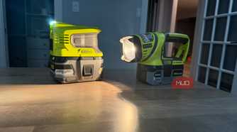 Ryobi power inverter and flashlight on desk shining onto surface