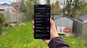 The Samsung Galaxy S26 Ultra in hand outside showing the battery menu.