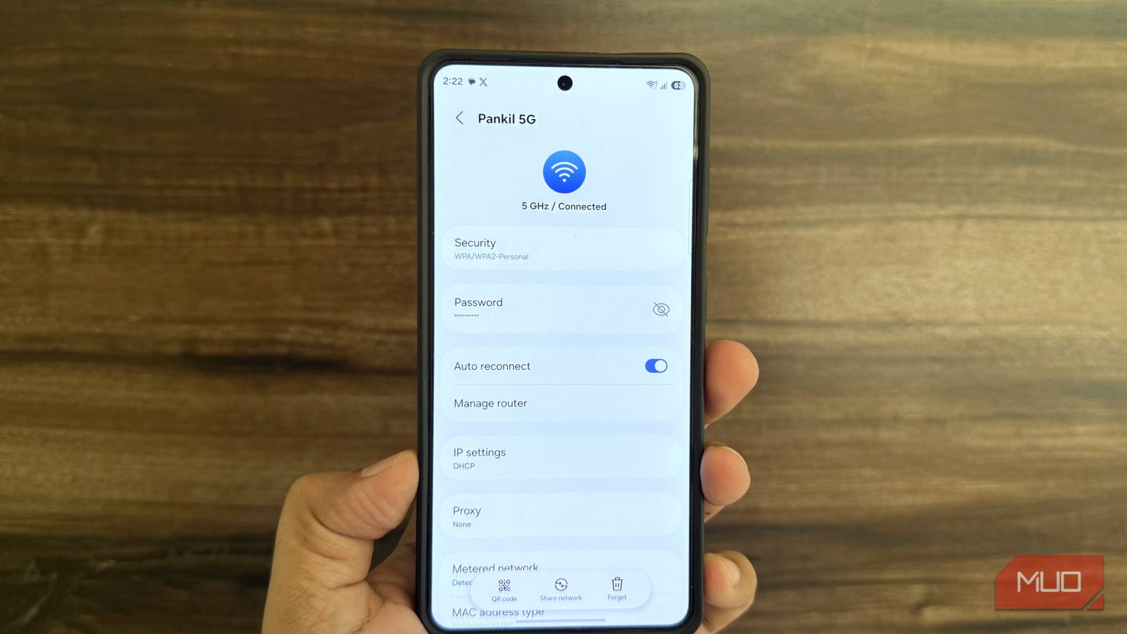 Samsung phone in hand showing Wi-Fi menu