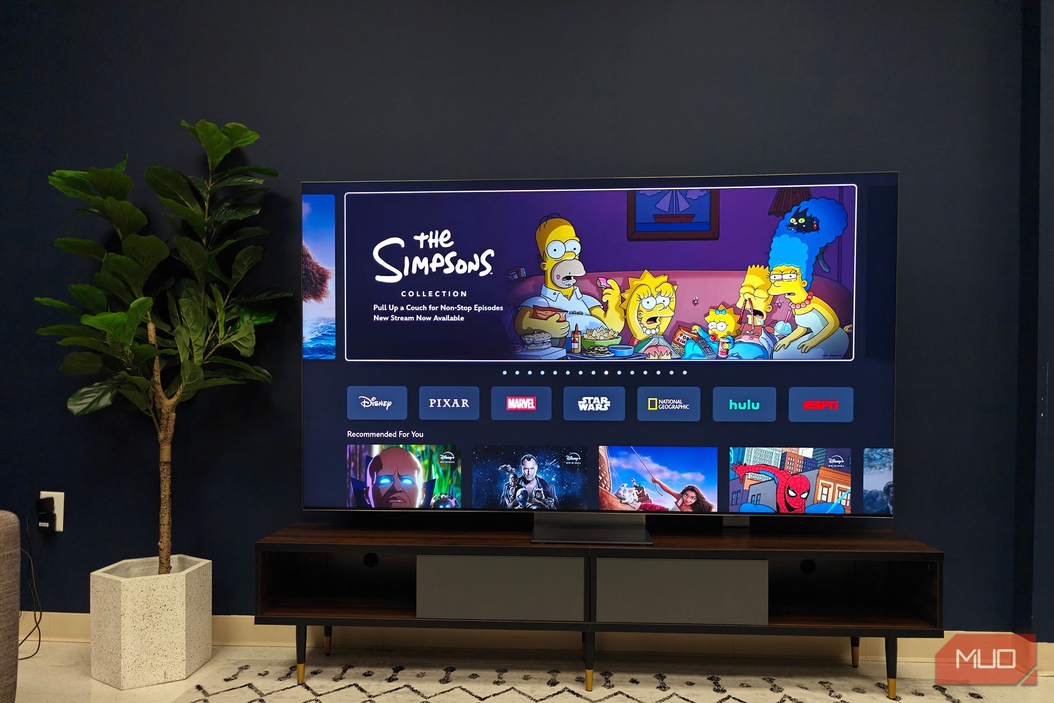 A Samsung QLED TV showing a guide menu.