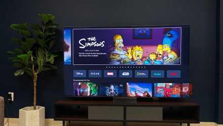 A Samsung QLED TV showing a guide menu.