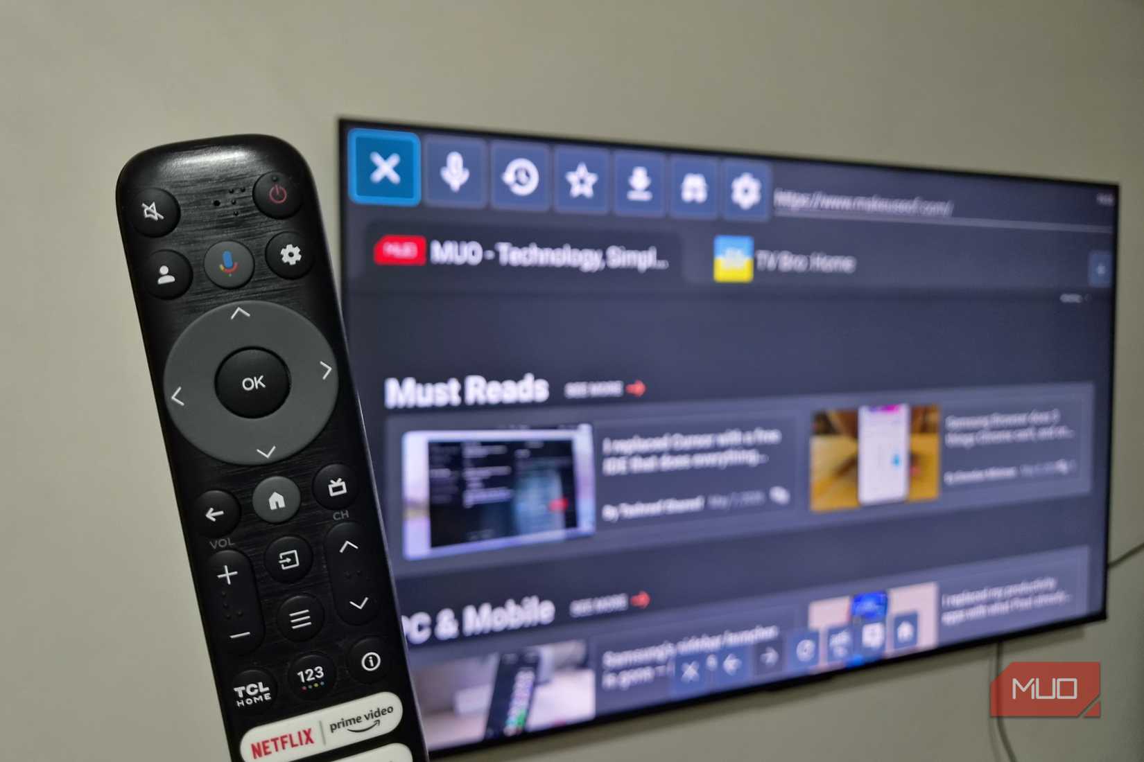 Smart TV showing TV Bro browser and a remote in front