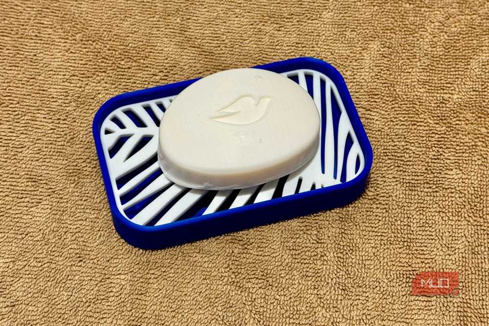 A two-part soap dish design with removable drain insert for easy cleaning