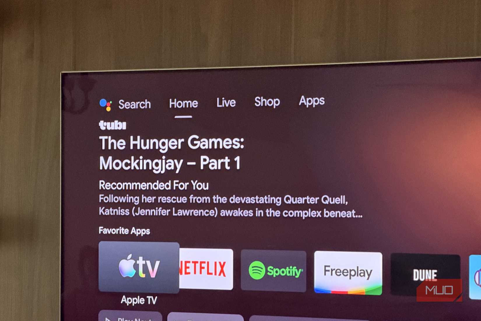 TV showing the Home, Live, Shop and Apps tabs in Android TV