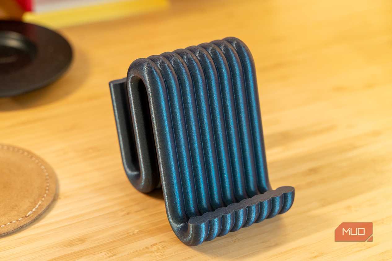 3D printed phone holder empty front view showing ribbed black blue filament.