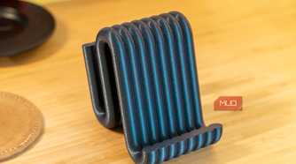 3D printed phone holder empty front view showing ribbed black blue filament.
