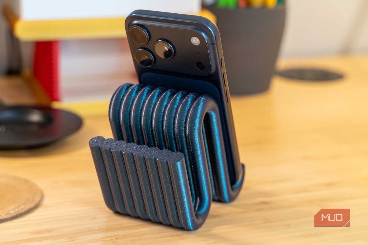 3D printed phone holder rear view with iPhone camera and ribbed support.