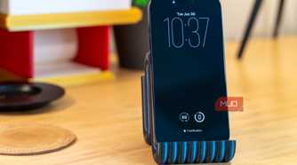 3D printed phone holder with iPhone front view on desk.