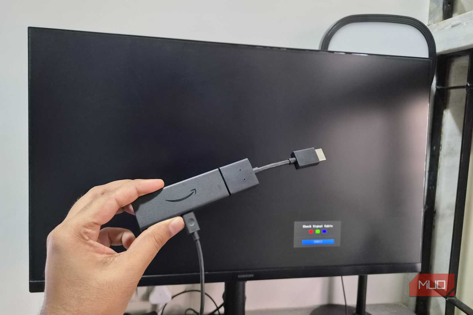 Amazon Fire TV stick in front of a monitor