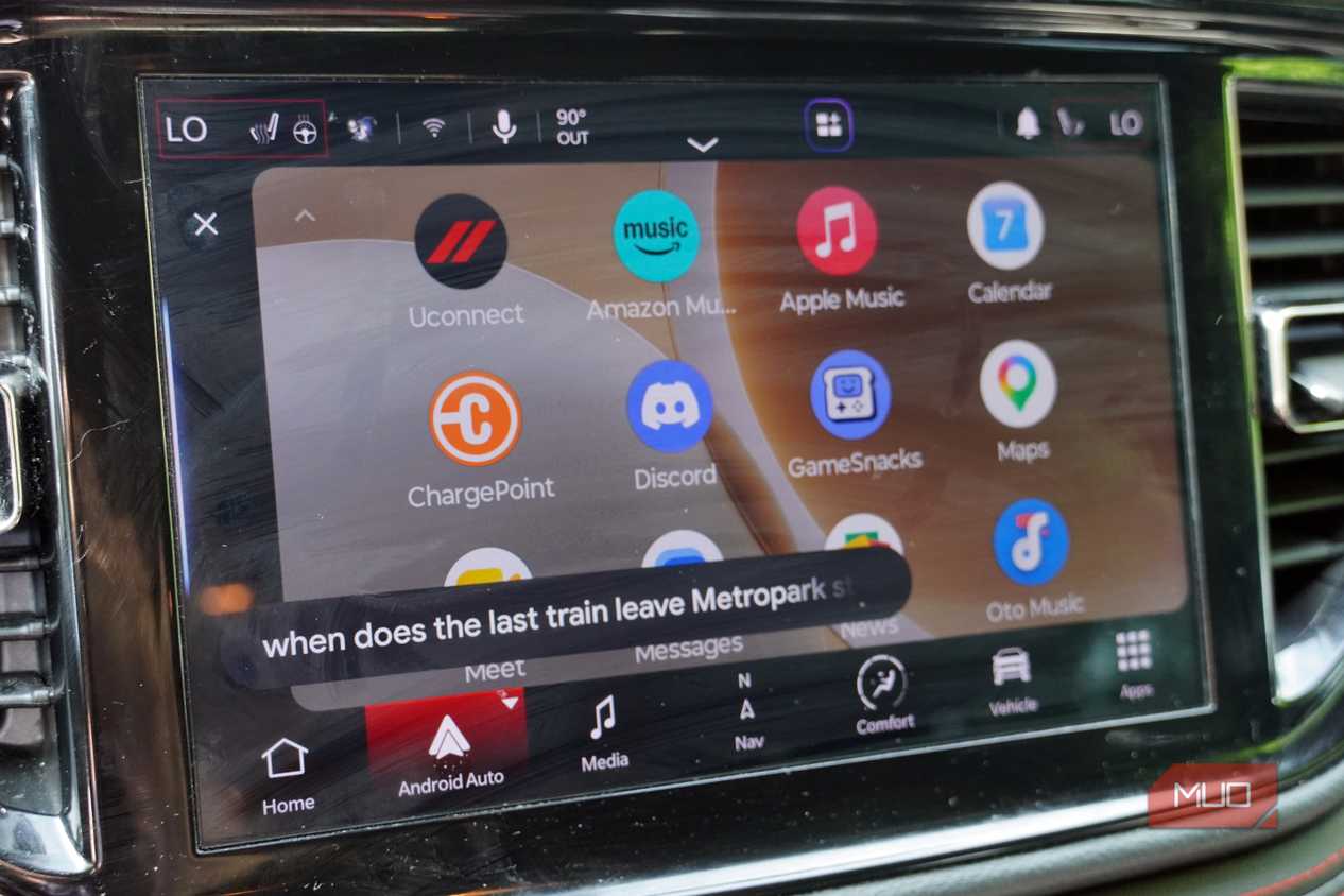 Asking Gemini for train information while driving with Android Auto.