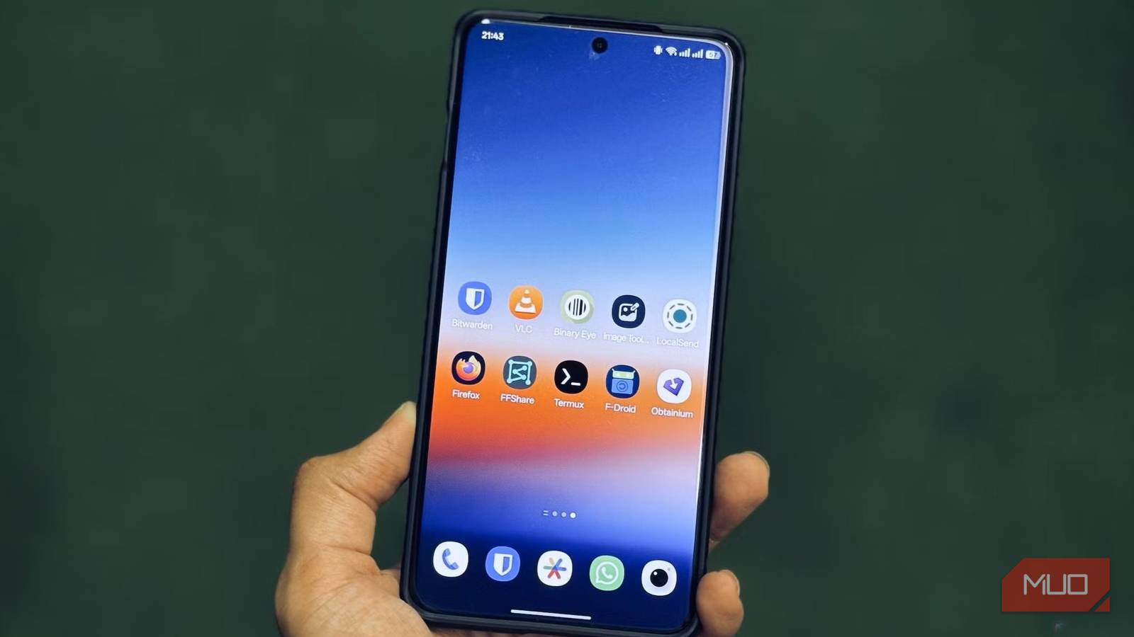 Android phone in hand showing open source apps
