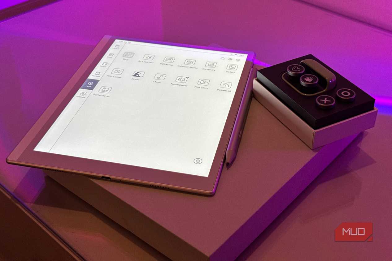 boox tappy case and buttons on box beside boox e-reader app drawer and stylus with purple lighting