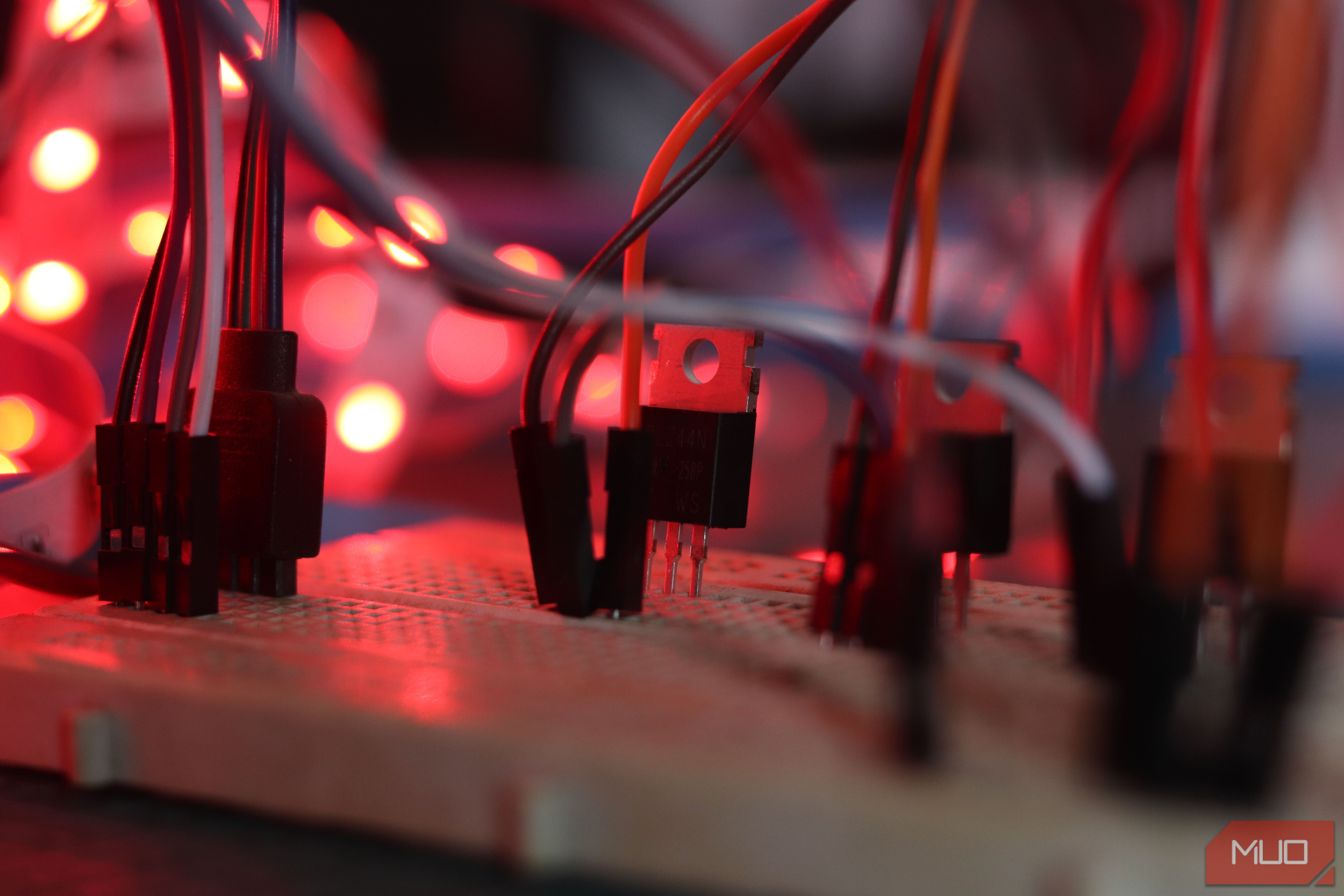 Closeup of IRLZ44N MOSFET on breadboard.