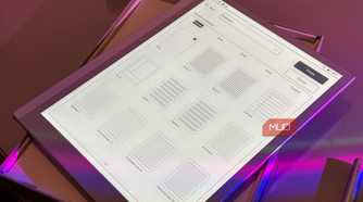 digital tablet displaying user interface wireframe mockups with purple ambient lighting