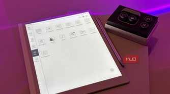 digital tablet with design application interface next to control panel device on purple surface