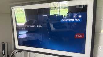 Echo Show 15 answering seven times four math question