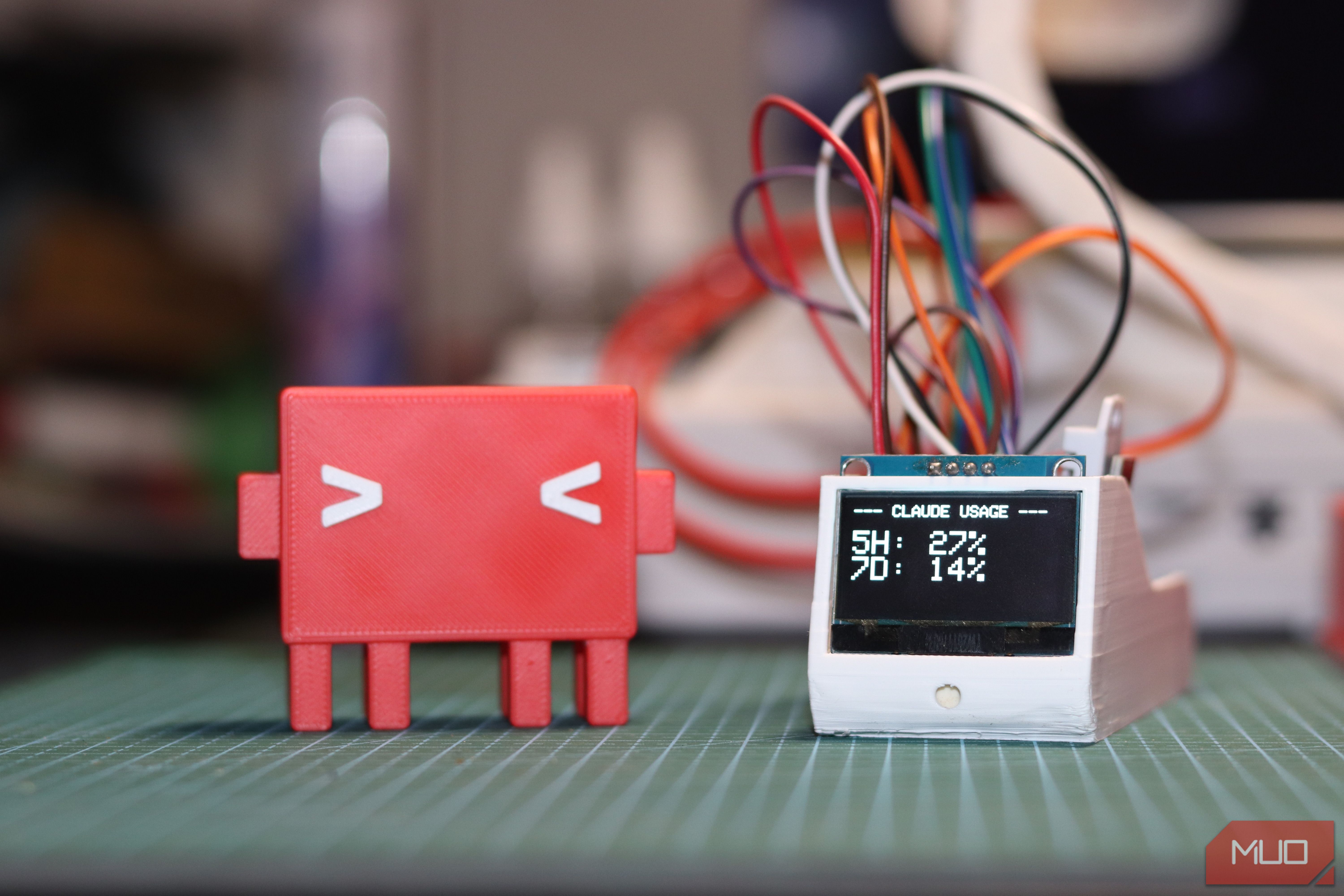 ESP32 dashboard with OLED screen and Claude Code mascot.