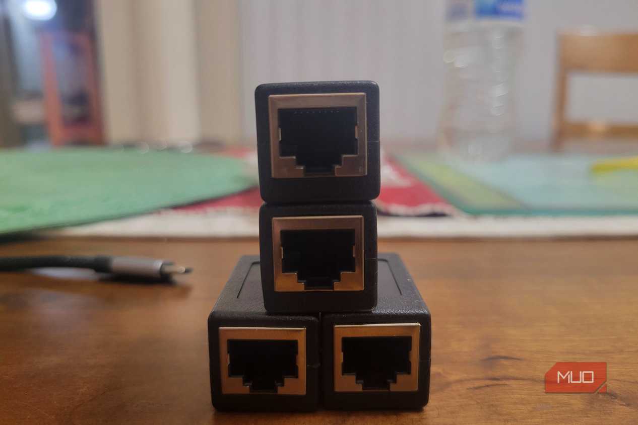 Four Ethernet ports lined up like a Creeper next to a dongle