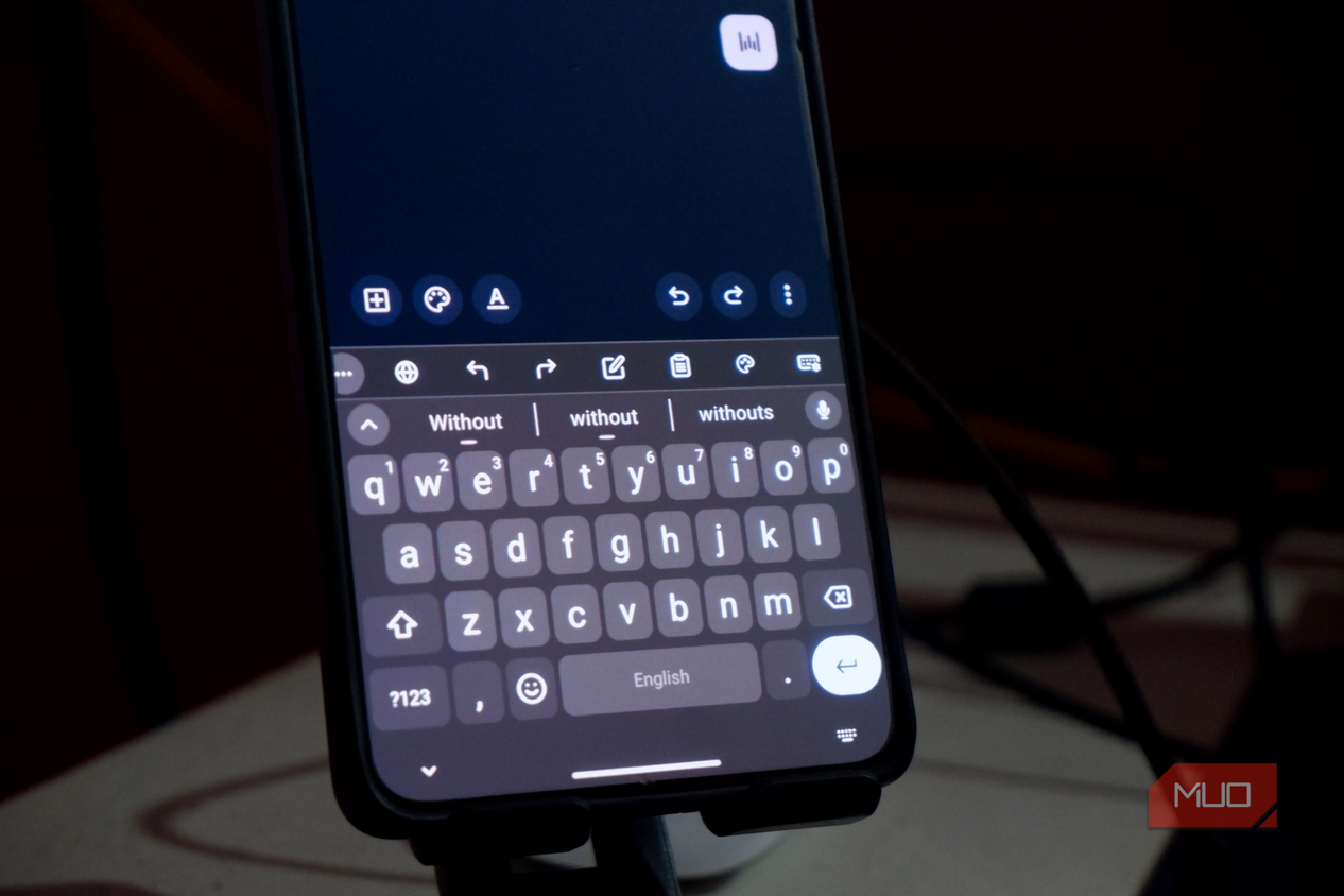 an Android smartphone showing the FUTO keyboard interface