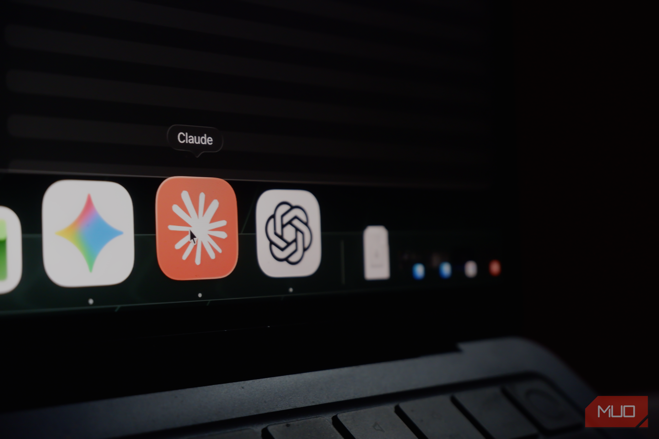 a MacBook Air dock displaying icons of Google Gemini, Claude, and ChatGPT