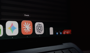a MacBook Air dock displaying icons of Google Gemini, Claude, and ChatGPT