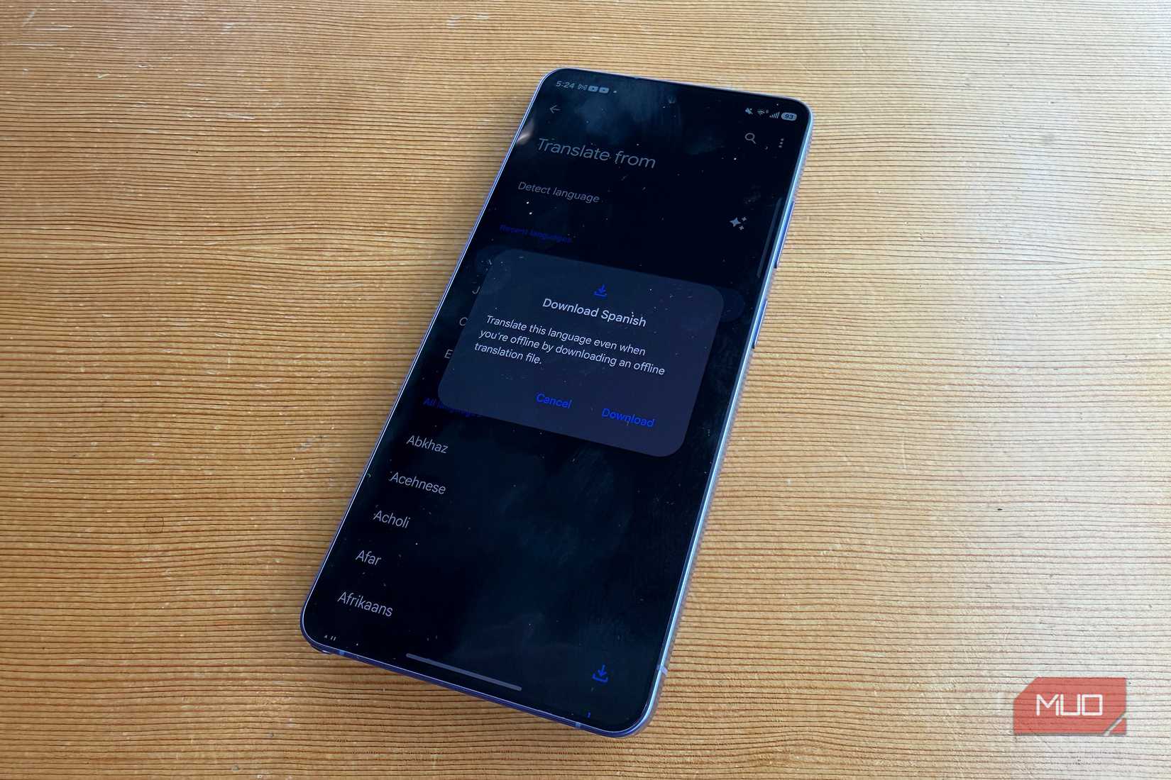 A Samsung Galaxy phone showing Google Translate to download Spanish.