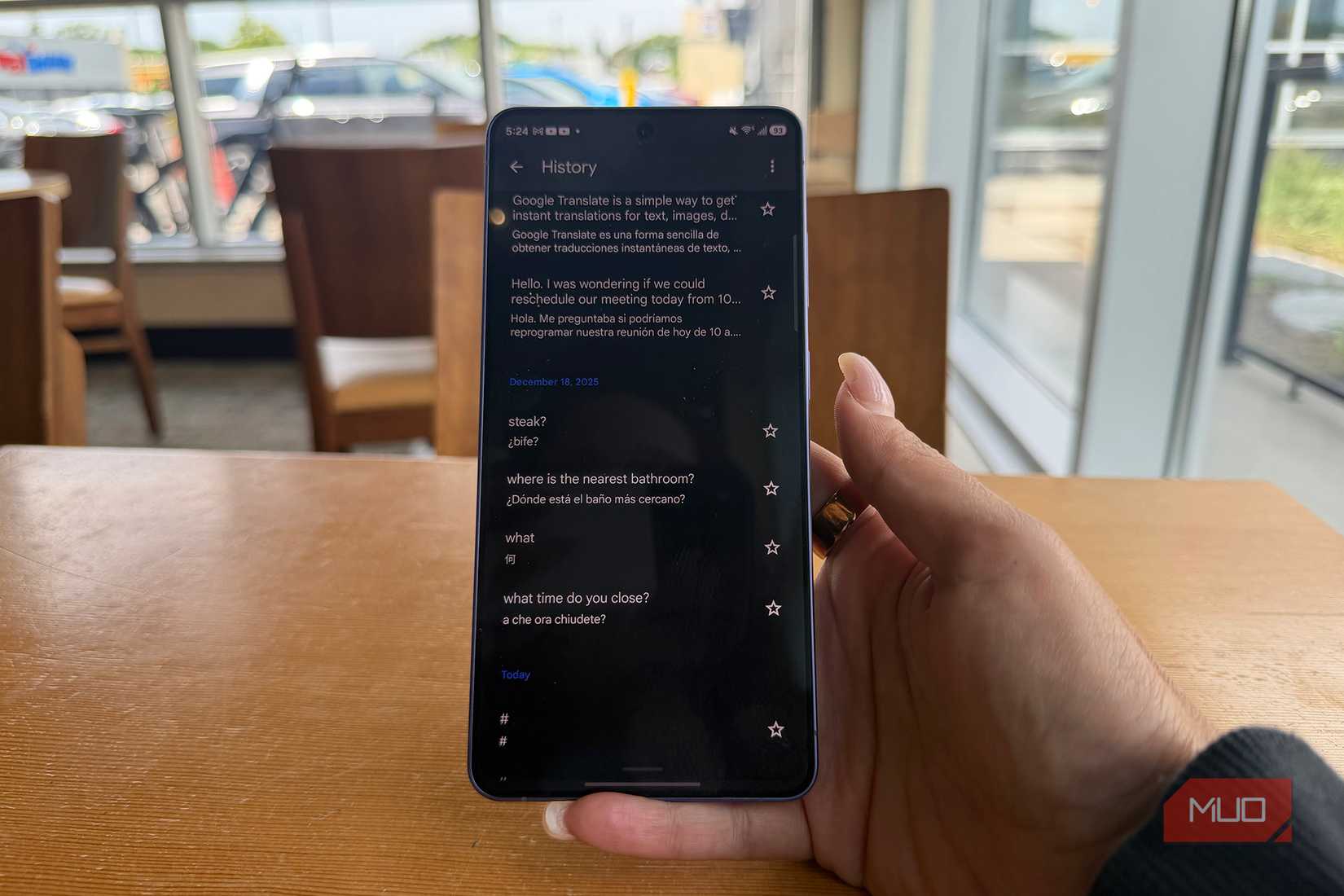 A phone showing Google Translate history.