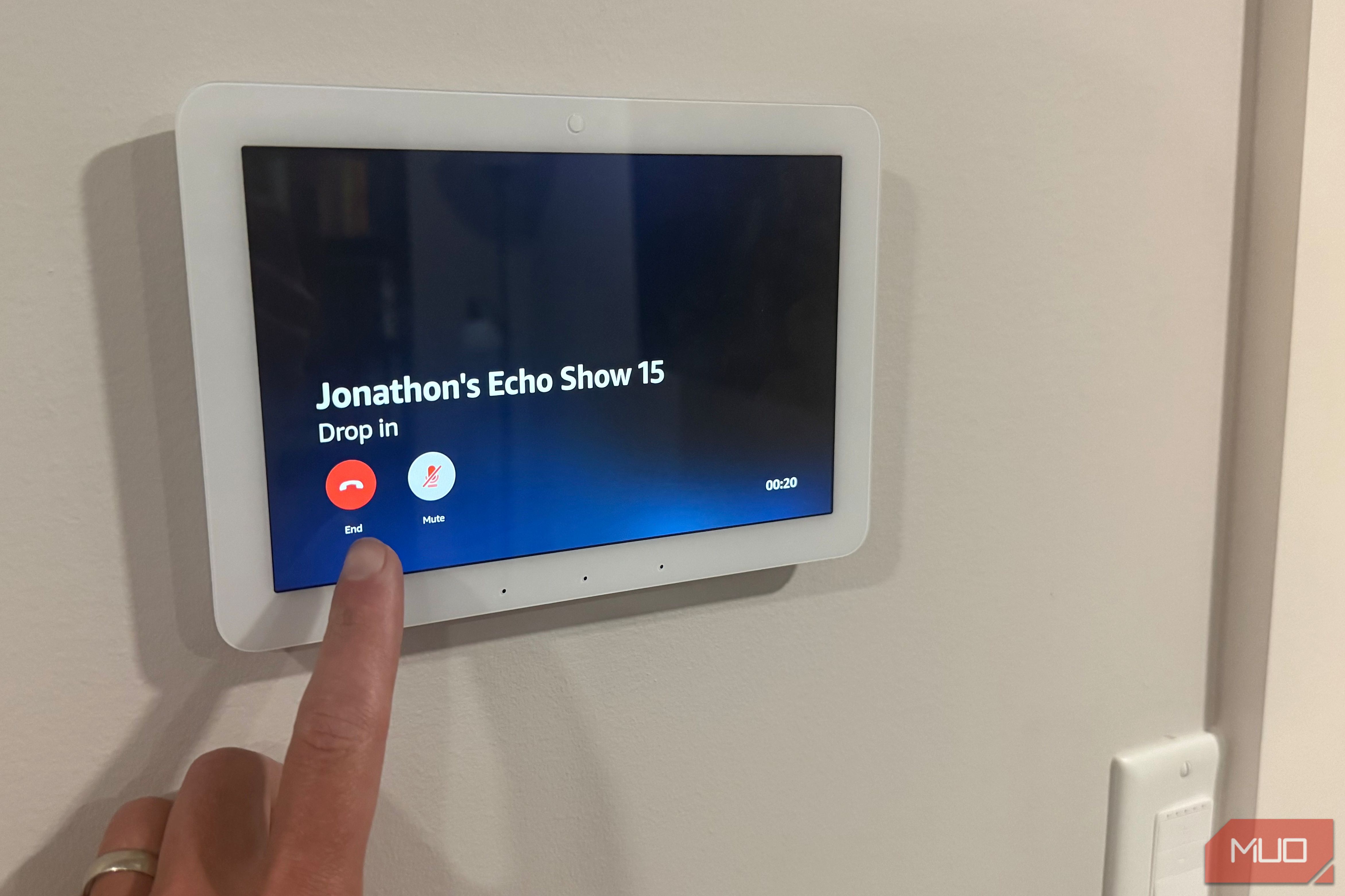 Hand pressing end on Echo Hub drop in call to Echo Show 15