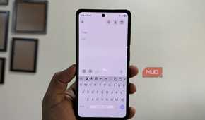 HeliBoard keyboard open on Samsung phone in hand