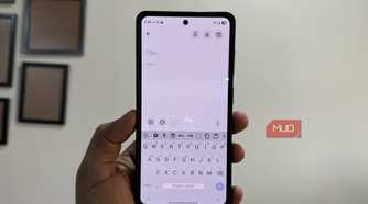 HeliBoard keyboard open on Samsung phone in hand