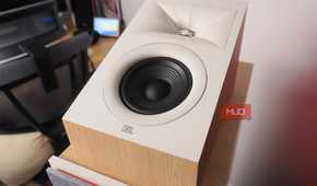 The JBL Stage2 Dolby Atmos speakers on top of floorstanding speakers.