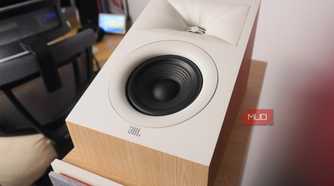 The JBL Stage2 Dolby Atmos speakers on top of floorstanding speakers.