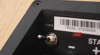 The Atmos switch on a pair of JBL Stage2 height speakers.