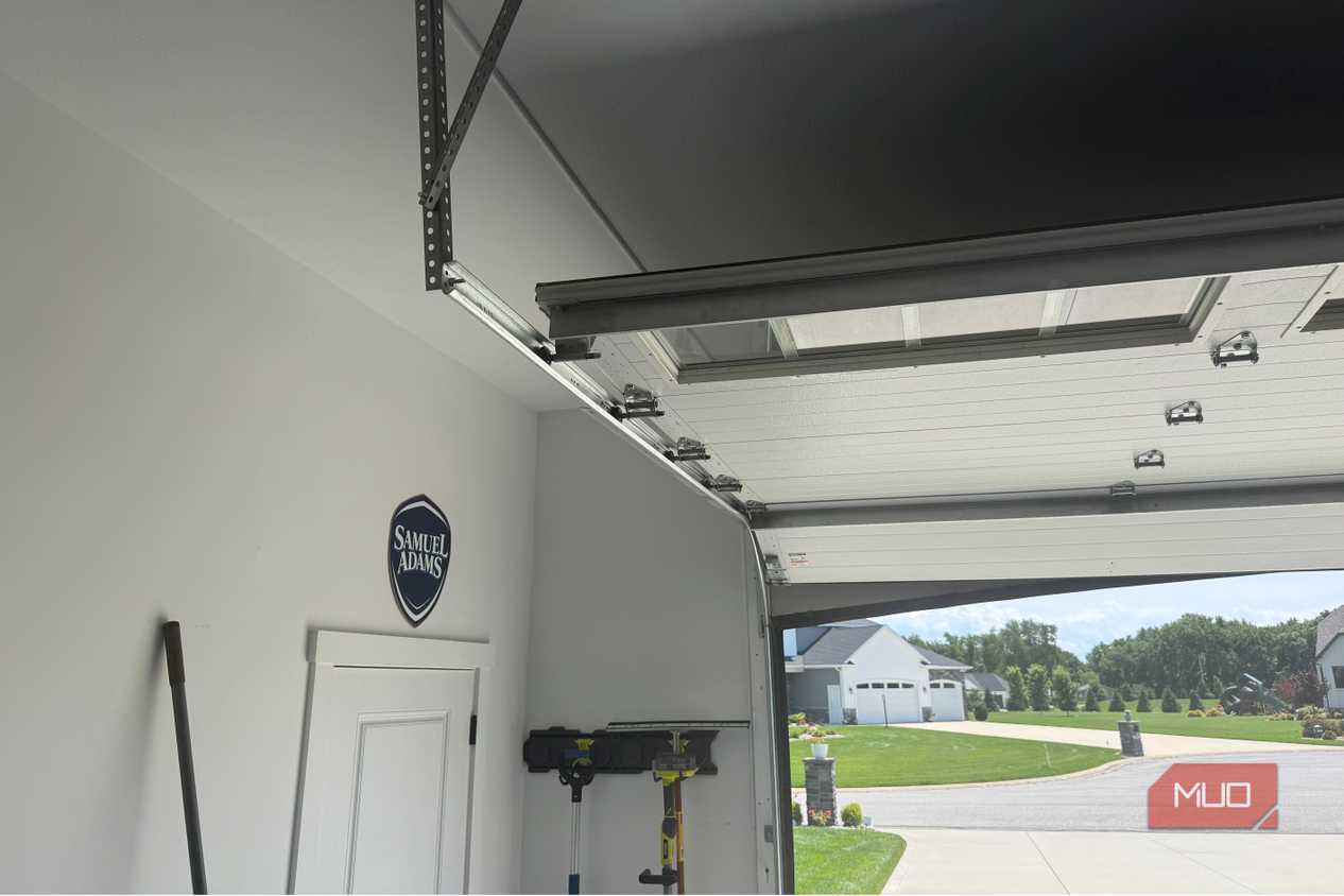 open garage door track with samuel adams sign on wall