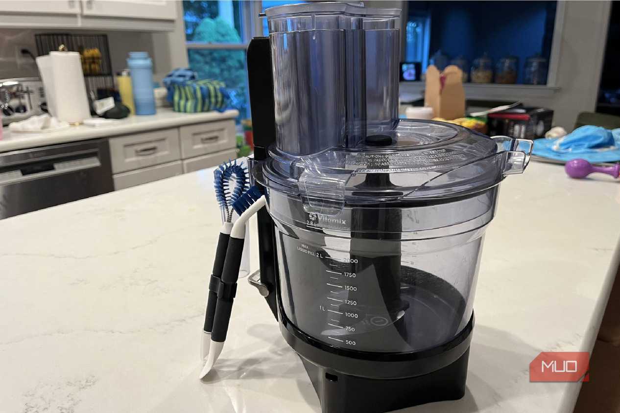 The OXO Good Grips Kitchen Appliance Cleaning Set near a Vitamix