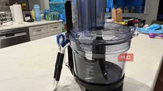 The OXO Good Grips Kitchen Appliance Cleaning Set near a Vitamix