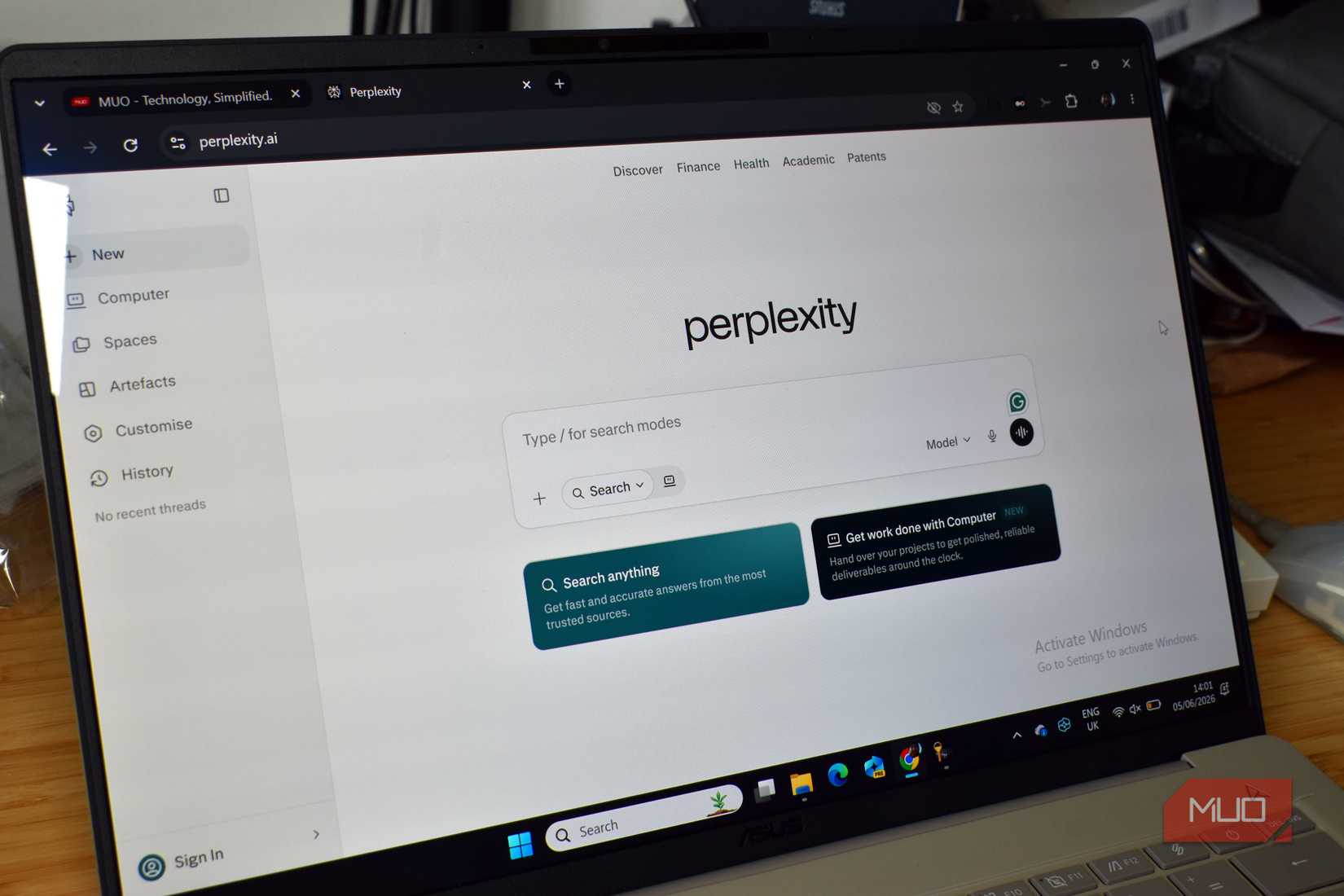 perplexity home page on laptop screen.